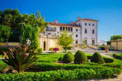 a large white building with a garden in front of it at GREAT LOCATION Downtown/Airport/South Beach in Miami