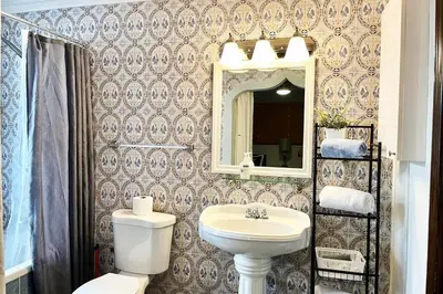 a bathroom with a sink and a toilet and a mirror at SUPER CLOSE Beach, Airport, port, Downtown, Wynwood in Miami
