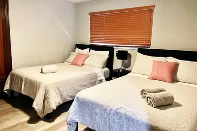 a bedroom with two beds with towels on them at SUPER CLOSE Beach, Airport, port, Downtown, Wynwood in Miami