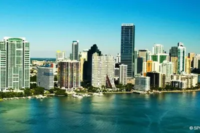 a view of a city from the water with buildings at SUPER CLOSE Beach, Airport, port, Downtown, Wynwood in Miami