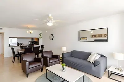 a living room with a couch and a table at Pavilion -Amazing bay sunset-Miami Beach in Miami Beach