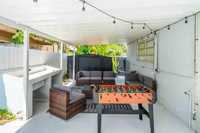 a ping pong table sitting on a patio at Miami Luxury Home! Next to Miami airport and beach in Miami