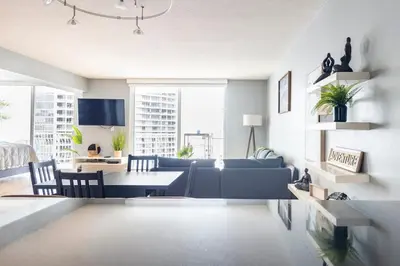 a living room with a couch and a table at Brickell Center w/City & Bay View + FREE Parking! in Miami