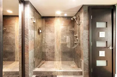 a shower with a glass door in a bathroom at Brickell Center w/City & Bay View + FREE Parking! in Miami