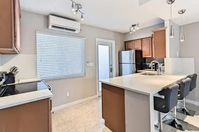 a kitchen with a counter top and a refrigerator at Wiltonplex B in Fort Lauderdale