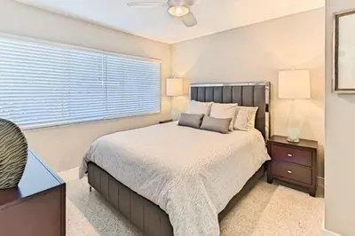 a bedroom with a large bed and a window at Wiltonplex C in Fort Lauderdale
