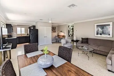 a living room with a couch and a table with chairs at Wiltonplex C in Fort Lauderdale