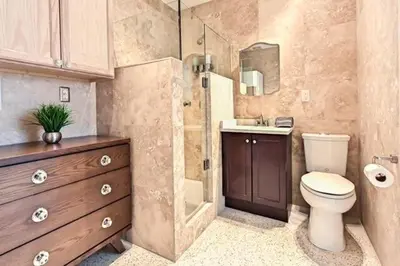 a bathroom with a toilet and a sink and a shower at Wiltonplex D in Fort Lauderdale