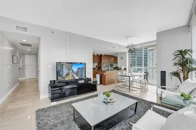 a living room with a couch and a table at Waterfront Luxury Apartment 2 Bedrooms IconBrickell in Miami