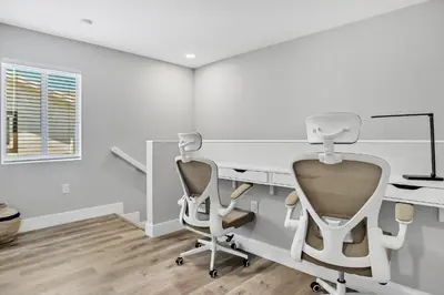 a white office with a desk and a chair at Sistrunk Shades Villas Units #1 & #2 Combined in Fort Lauderdale