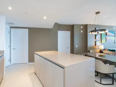 a kitchen with a white island in a room at Luxury Ocean Escape by Cielo Stays in Hollywood