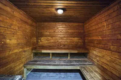 an empty wooden sauna with a bench in it at Miami Vibes! Biscayne Bay Water and Park Views! in Miami