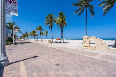 a beach with palm trees and the ocean at Lovely Studio Walking Distance To Ocean - Suite 8 in Hollywood