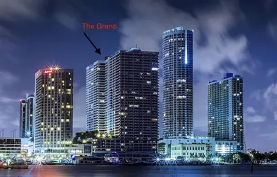 a group of tall buildings in a city at night at Shock Wave! NEW Renovated Condo With Water Views! in Miami