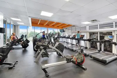a gym with treadmills and cardio machines in it at Sea Forever! Miami Skyline And Water Views in Miami