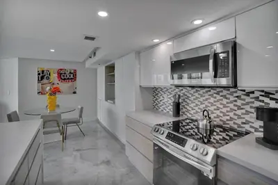 a kitchen with a stove and a counter top at GoldDust - Water and City Views! in Miami