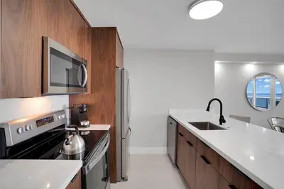 a kitchen with a sink and a stove at Fantasy! Water & Park Views! in Miami