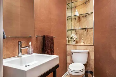 a bathroom with a white sink and a toilet at Villa sleeps 18 in Miami Shores with Movie theater / Pool / Jacuzzi in Miami