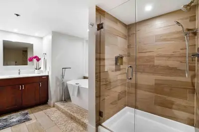 a bathroom with a shower with a glass door at Aqua Marina! Water & City Views! in Miami