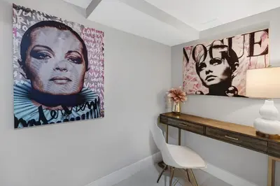 a room with two large artworks on the wall at The Queen B! Water & Skyline Views - Renovated in Miami