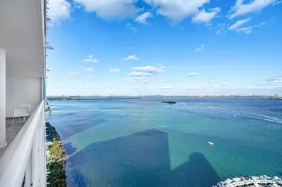 a view of the ocean from the balcony of a building at First Class! - Crystal clear water views! in Miami