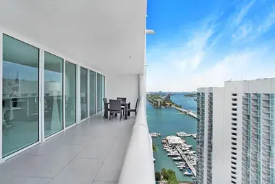 a balcony of a building with a view of a harbor at Enchanted! Miami Skyline & Water Views in Miami
