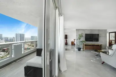 a living room with a view of a building at Classic Beauty! Skyline and water views in Miami