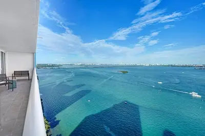 a view of the ocean from the balcony of a building at The Audrey! Penthouse With Direct Water Views! in Miami