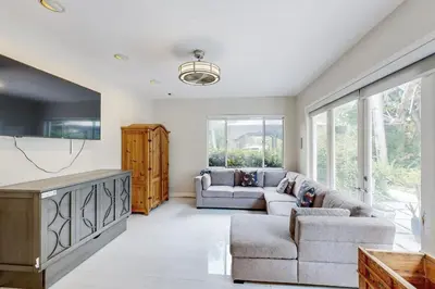 a living room with a couch and a table at Sunny Oasis in Hollywood