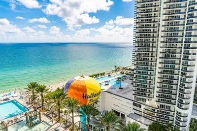 a view of the beach and the ocean from the balcony of a building at HydeHotel 2BED Lux Condo Ocean View Resort in Hollywood