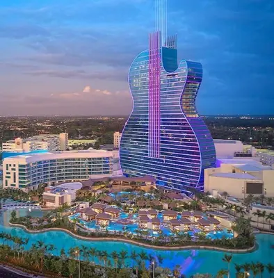 a hotel with a guitar shaped building with a resort at Hollywood Beachfront Apartment in Hollywood