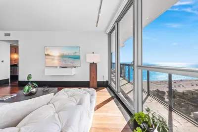 a living room with a white couch and large windows at THE SETAI 5 STARS HOTEL-RESIDENCE MIAMI BEACH OCEANVIEW 2 Bedroom UNIQUE in Miami Beach