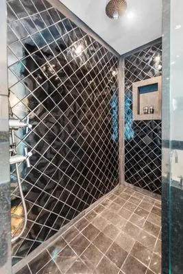 a bathroom with black tiled walls and a shower at THE SETAI 5 STARS HOTEL-RESIDENCE MIAMI BEACH OCEANVIEW 2 Bedroom UNIQUE in Miami Beach