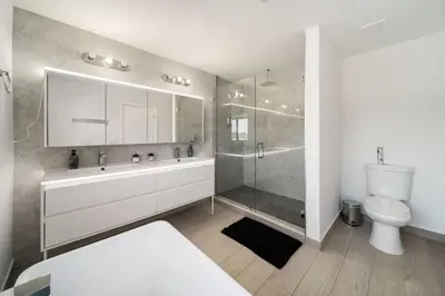a bathroom with a shower and a sink and a toilet at Modern RocknHome Near Hard Rock and FLL Airport in Fort Lauderdale