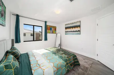 a bedroom with a bed and a window at Modern RocknHome Near Hard Rock and FLL Airport in Fort Lauderdale