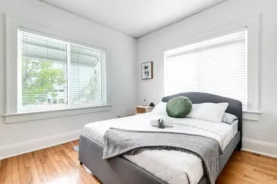 a bedroom with a bed with a green pillow on it at Cozy Little Havana Apt Centrally located Hv2 in Miami