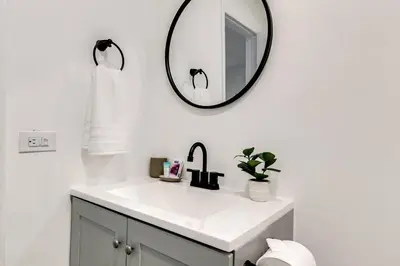 a bathroom with a sink and a mirror on the wall at Airport Loft 1b full kitchen Virg 10 in Miami