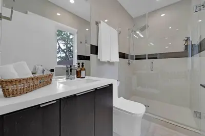 a bathroom with a shower and a toilet and a sink at Casa Copal: Relaxing Beach House in Hollywood