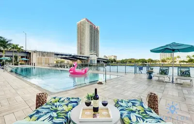 a swimming pool with a pink inflatable raft at Oceanfront Balcony Enjoy Endless Views Hot Tub in Hollywood