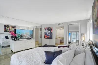 a living room with a white couch and a tv at Wildest Dreams Penthouse! Dreams Do Come True in Miami