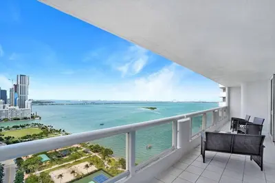 a balcony with a view of the ocean at Magic City! Water And Park Views! in Miami