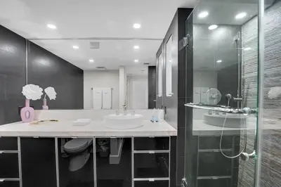 a bathroom with a sink and a shower at Iconic! Miami Skyline & Water Views in Miami