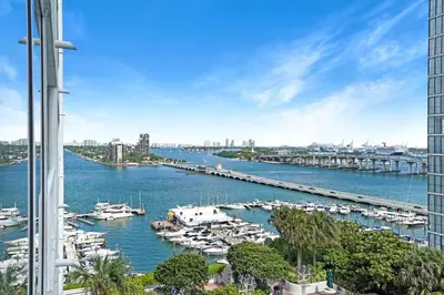 a view of a marina with boats in the water at Life Is Gucci! Gorgeous WATER VIEWS Miami Condo! in Miami