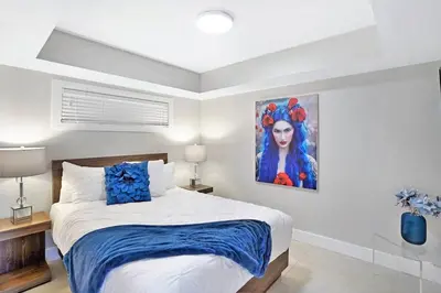 a bedroom with a bed and a painting on the wall at Champagne & Ice! Water Views, 2 Private Balconies! in Miami