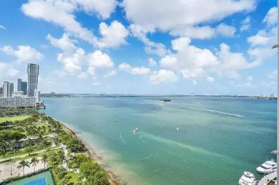 a view of the ocean with a beach and buildings at Big Energy! Water Views and Newly Renovated! in Miami