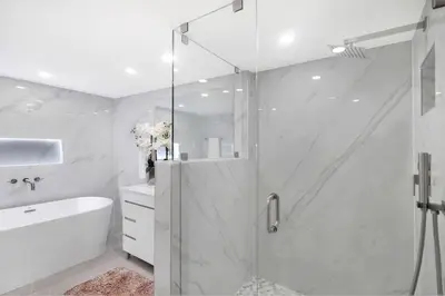 a bathroom with a shower and a tub and a sink at Sweet Dreams! Renovated with Water Views in Miami