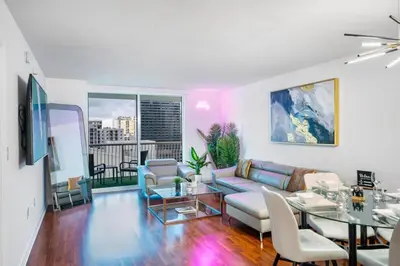 a living room with a couch and a table at Modern Bayview Apartment in Brickell Bay in Miami