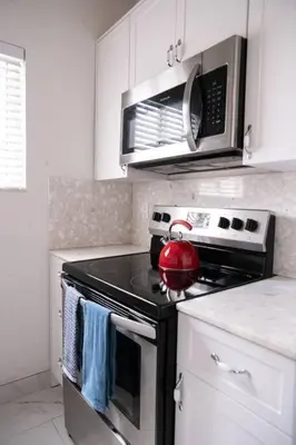 a kitchen with a stove with a tea kettle on it at Homey Little Havana Apt Centrally located Hv4 in Miami