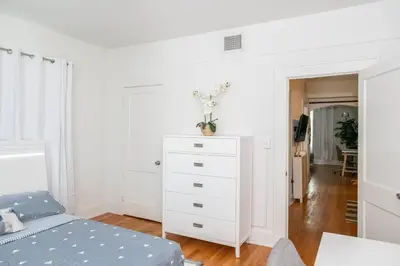 a bedroom with a white dresser and a bed at Homey Little Havana Apt Centrally located Hv4 in Miami