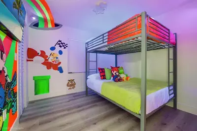 a childs bedroom with a bunk bed and a mural at Flamingo's Resort -Htd Pool, 5 Bedrooms, Game Room, Baby Items , BBQ in Miami
